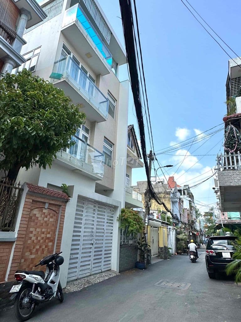 NGAY CHỢ AN NHƠN. NHÀ KHỦNG 4 TẦNG. 6,5x14. OTO NGỦ NHÀ. HƠN 100TR/M